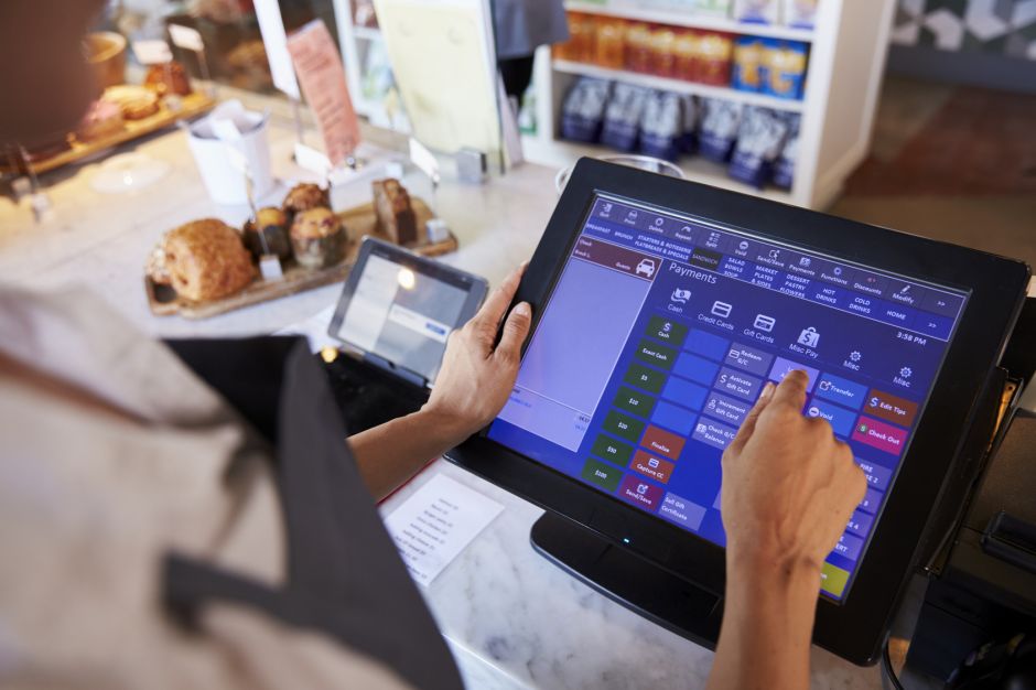 Monkey Business – stock.adobe.com Close Up Of Female Employee Working At Delicatessen Checkout